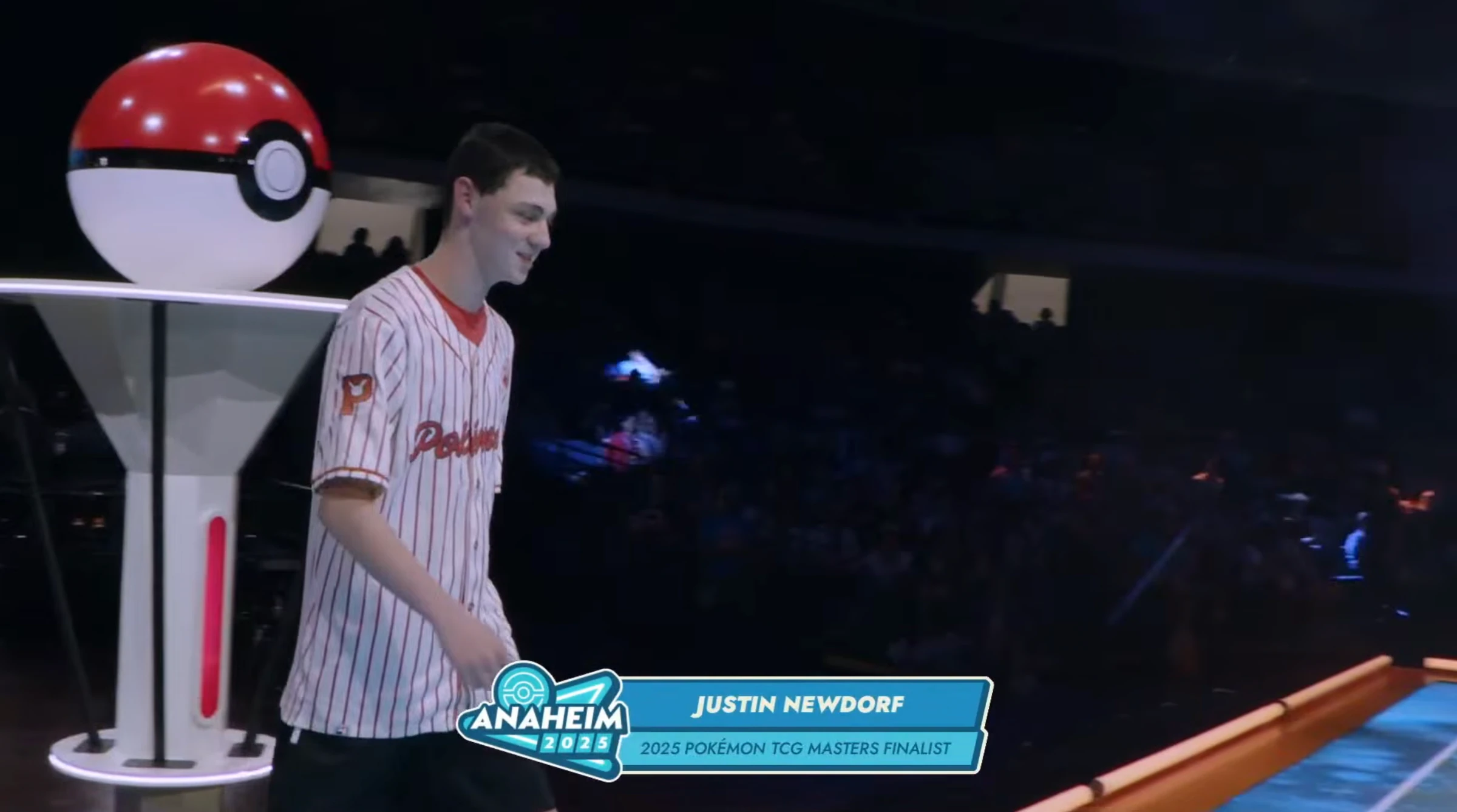 Justin Newdorf walking onto the stage at Anaheim 2025 to receive the runner-up trophy of the Pokémon TCG World Championship in the Masters division